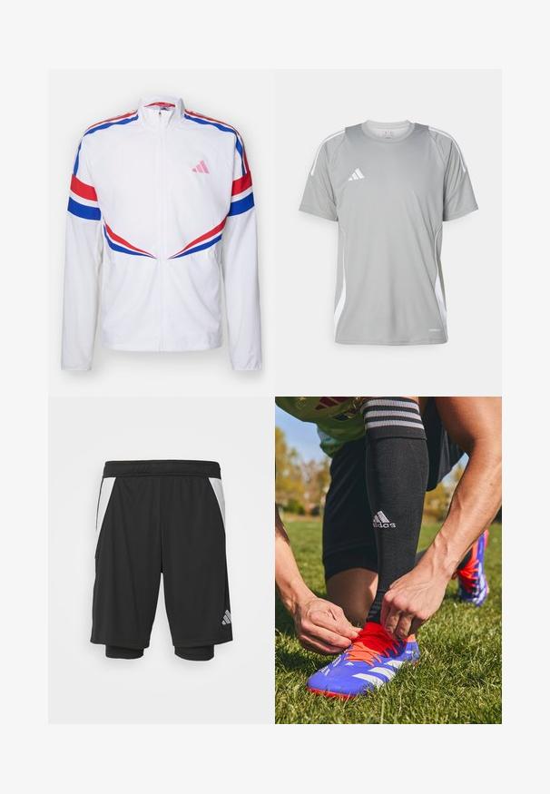 Bijela jakna na zip s crvenim i plavim prugama preko ramena i sa strane. Ima ružičasti logo na prsima i teksturirani materijal.; Svijetlosivi atletski majica kratkih rukava, s bijelim akcentima i Adidas logotipom na lijevoj strani prsnog područja. Izrađena od prozračnog materijala.; Crne atletske kratke hlače s laganom tkaninom, bijelim bočnim panelima, elastičnim pojasom i reflektirajućim logotipom na donjem lijevom dijelu.; Plavi i narančasti nogometni kopački s bijelim prugama, koje veže ruka. Crne čarape s prugama vidljive iznad gležnja. Pozadina od zelene trave.