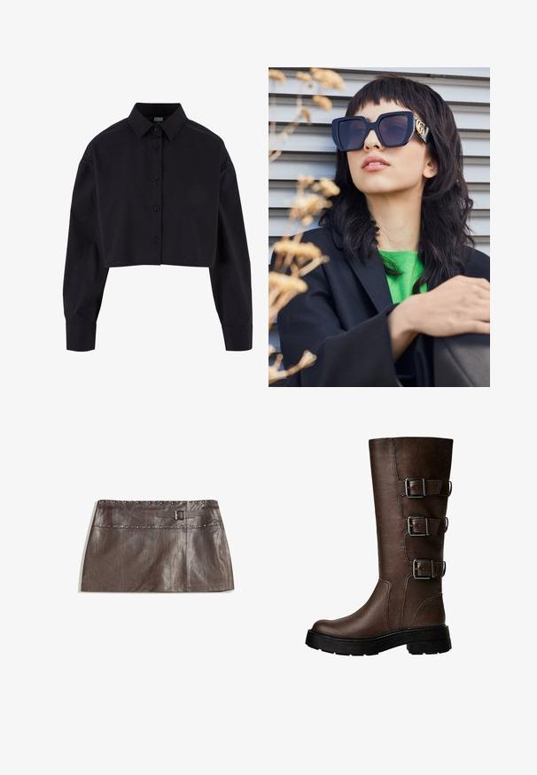 Barna bőrkabát műszőrme gallérral, laza fazonnal, bordázott derékrészsel és két oldalsó zsebbel. Két gomb található az elülső részen a záródáshoz.; Fekete, rövidre vágott, pamut ing, hosszú ujjakkal, klasszikus gallérral és egyenes szegéllyel.; Barna bőr mini szoknya, szegecselt derékrésszel és csatos övhurkokkal, sima textúrával és letisztult, egyenes fazonnal.; Barna bőr térdig érő csizma három fém csattal, texturált felület, kerek orr és vastag talp a stabilitás érdekében.; Túlméretezett fekete napszemüveg vastag kerettel és arany díszítéssel, fekete blézerral és élénk zöld inggel viselve, vízszintes háttér előtt.