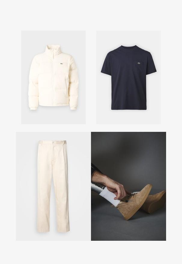 Casaco de puffer branco com colarinho alto, apresentando um fecho frontal com zíper, punhos elásticos e um pequeno logótipo verde no lado esquerdo do peito.; T-shirt de algodão azul-marinho com decote redondo e mangas curtas. Apresenta um pequeno logo verde no bolso esquerdo do peito. Textura suave.; Calças de algodão bege com corte reto, apresentando um fecho de botão e pregas na frente para um detalhe adicional.; Botas de tornozelo em camurça bege com atacadores à frente, fecho lateral em zip e sola de borracha castanha. Uma mão ajusta o sapato sobre uma meia branca.