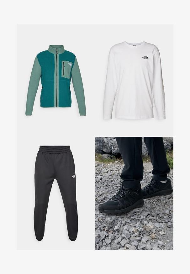 Polarowa kurtka w odcieniach turkusowym i zielonym, z wysokim kołnierzem, pełnym zamkiem błyskawicznym, bocznymi kieszeniami oraz kieszenią na piersi z zamkiem błyskawicznym i detalem z logo.; Biała koszulka z długim rękawem wykonana z bawełny, z okrągłym dekoltem. Posiada małe czarne logo na piersi. Gładka faktura, regularny krój.; Czarne dresy z elastycznym paskiem w talii, zwężanym krojem, elastycznymi mankietami i małym białym logo na lewej udzie, wykonane z gładkiego materiału.; Czarne buty outdoorowe wykonane z siateczki i materiału syntetycznego, z fakturowaną cholewką, zabezpieczonym systemem sznurowania i solidną podeszwą, na skalistym terenie.