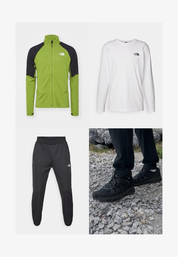 Zielona polarowa kurtka z czarnymi akcentami na ramionach, z zamkiem na całej długości, wysokim kołnierzem i logo na piersi; teksturowany materiał z dwoma bocznymi kieszeniami.; Biała koszulka z długim rękawem wykonana z bawełny, z okrągłym dekoltem. Posiada małe czarne logo na piersi. Gładka faktura, regularny krój.; Czarne dresy z elastycznym paskiem w talii, zwężanym krojem, elastycznymi mankietami i małym białym logo na lewej udzie, wykonane z gładkiego materiału.; Czarne buty outdoorowe wykonane z siateczki i materiału syntetycznego, z fakturowaną cholewką, zabezpieczonym systemem sznurowania i solidną podeszwą, na skalistym terenie.