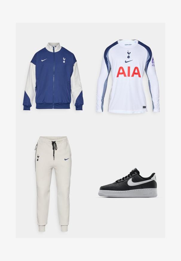Tumesinine jakk, millel on valged varrukad, täispikk tõmblukk, kõrge kaelus, Nike logo ja Tottenham Hotspuri embleem vasakul rinnaosal.; Valge pikkade varrukatega jalgpallipluus, millel on mereväe sinised aktsendid, Tottenham Hotspuri logo ja punane "AIA" ees.; Heledad hallide Nike spordipüksid mustade aktsentidega. Omab tikitud logosid, elastset vöökohta koos paelaga ja soonikkandiga pahkluudes.; Must musta sneaker tekstureeritud pinnaga, valge Nike logo, hall tald, ümar varv ja paeltega disain. Omab perforatsioone varbakasti peal.