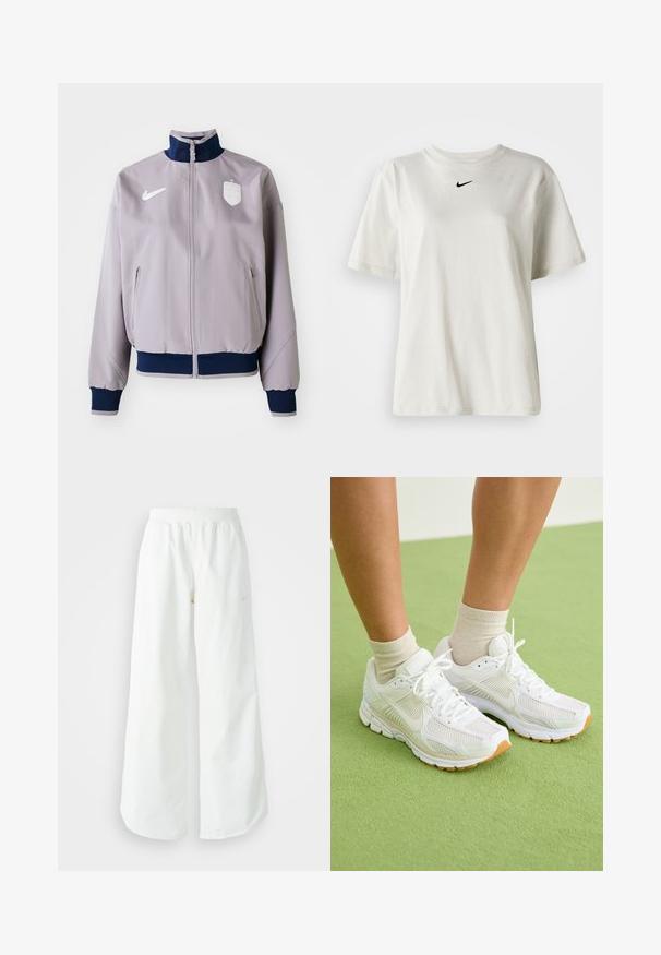 Lichtgrijze bomberjack met een marineblauwe kraag en manchetten, voorrits, zijzakken en een wit logo en embleem op de borst.; Witte katoenen t-shirt met een ronde halslijn en korte mouwen. Heeft een klein zwart Nike-logo op de borst. Eenvoudig en onopgesmukt ontwerp.; Witte atletische broek met wijde pijpen, een geribde tailleband en subtiele logodetails. Soepele stof met een relaxte pasvorm en taps toelopende zoom.; Witte sportieve schoenen van mesh-stof, met rubberen zolen en beige accenten. G gedragen met lichtgekleurde sokken op een groene ondergrond.
