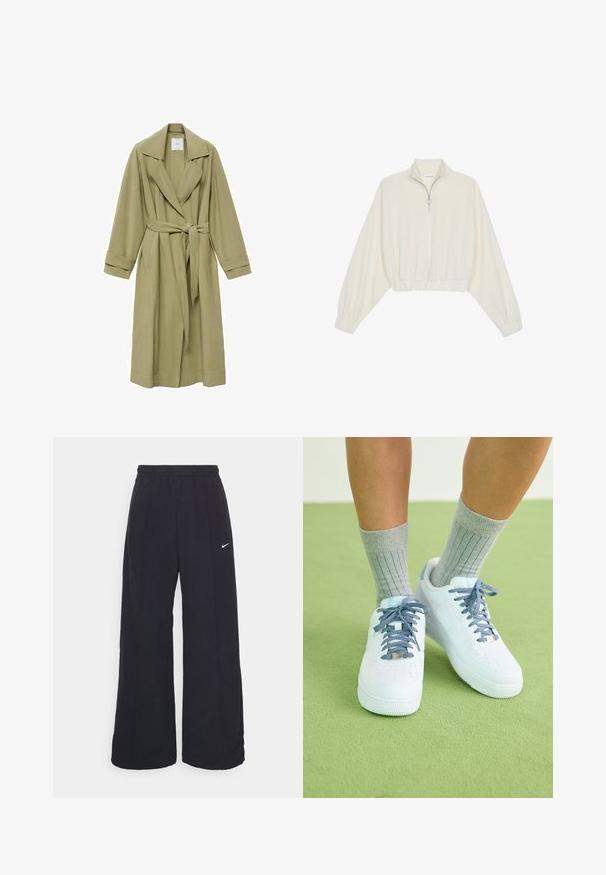 Olijfgroene trenchcoat met een ingesneden kraag, strikceintuur en lange mouwen. Heeft een gladde textuur en twee zijzakken.; Geknipt pullover in crèmekleurige stof, met een hoge kraag, halve rits, elastische zoom en manchetten, met een soepele textuur en minimalistisch ontwerp.; Zwarte wijde broek met een elastische tailleband en een klein wit Nike-logo. De stof heeft een soepele textuur, ontworpen voor comfort en casual gebruik.; Witte leren sneakers met blauwe accenten, geperforeerd teenontwerp en textuur van blauw-witte veters, gedragen met grijze geribbelde sokken.