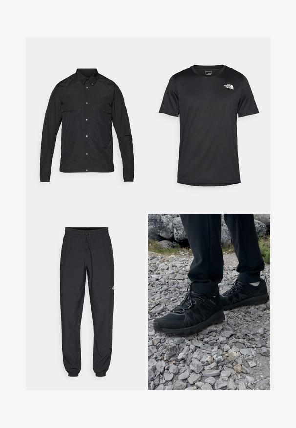 Zwarte jas van lichtgewicht materiaal met een knoopsluiting aan de voorkant, een puntige kraag en twee voorzakken. Soepele textuur, minimalistisch ontwerp.; Zwarte T-shirt met korte mouwen van gestructureerde stof, voorzien van een klein wit logo op de bovenste linkerborst, rond de hals.; Zwarte sportieve broek gemaakt van lichtgewicht stof, met een trekkoord in de taille, zijzakken en taps toelopende boorden bij de enkels.; Zwarte buitenschoenen van mesh en synthetisch materiaal, met een gestructureerd bovenwerk, een beveiligd vetersysteem en een robuuste zool, op een ruig terrein.