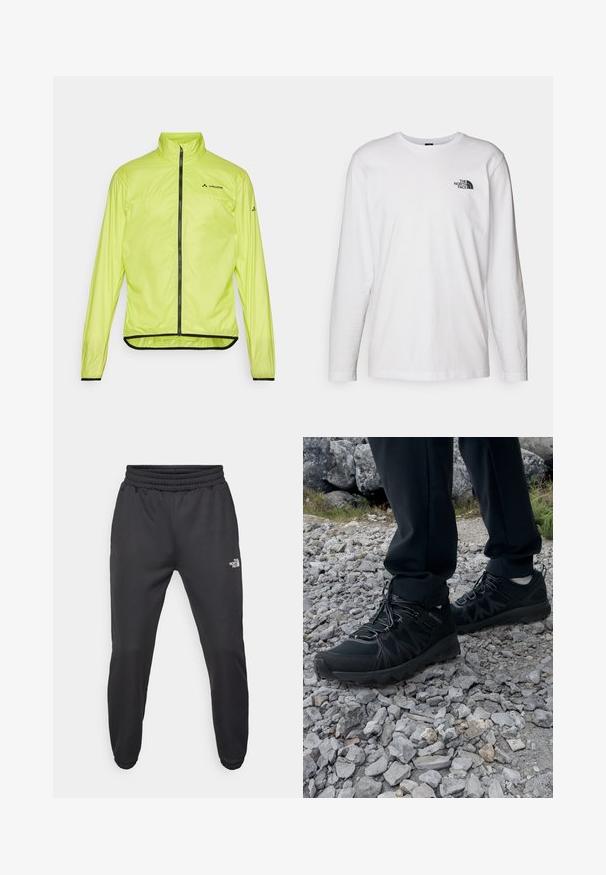 Yellow waterproof jacket with a high collar, full front zipper, and black trim. Features logo on chest and cuffs, made from lightweight material.; White long-sleeve T-shirt made of cotton with a crew neck. Features a small black logo on the chest. Smooth texture, regular fit.; Black sweatpants with a drawstring waist, tapered fit, elastic cuffs, and a small white logo on the left thigh, made from smooth fabric.; Black outdoor shoes with mesh and synthetic material, featuring a textured upper, secured lacing system, and a rugged outsole, on rocky terrain.