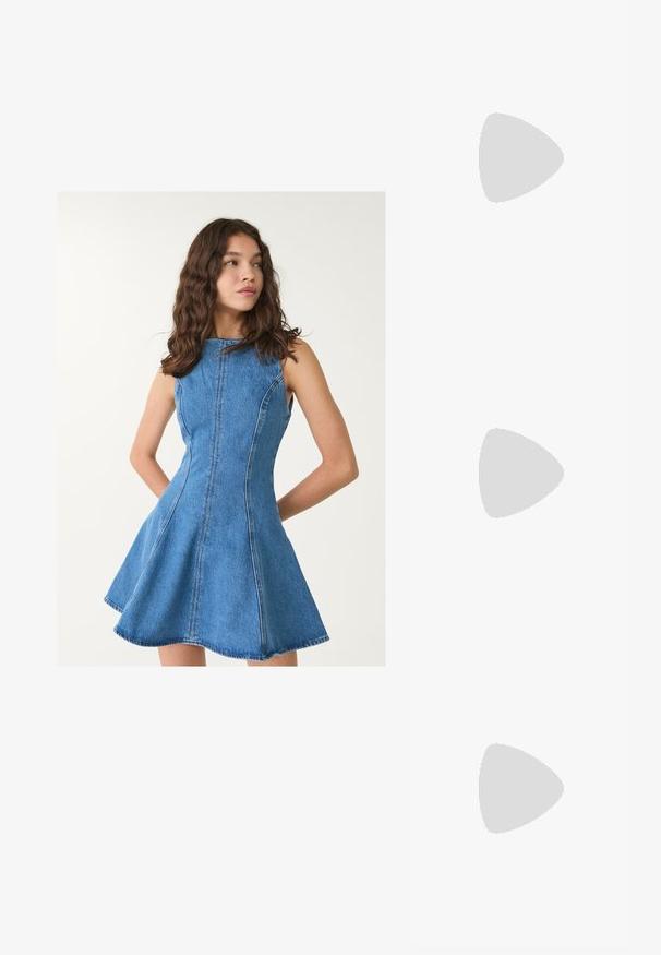 Stradivarius Denim dress - blue denim; Light pink athletic shoes with a textured suede upper, featuring a white outsole and subtle branding, paired with dark blue denim jeans.; Tortoiseshell sunglasses with a geometric design, yellow lenses, and metal accents on the temples. Wide frame and matte texture.; Brown leather crossbody bag with logo pattern, gold chain strap, zipper closure, and gold hardware accents. Compact and rectangular shape.