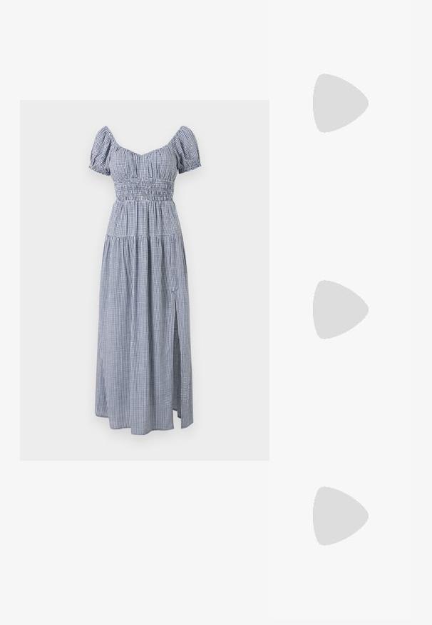 Tricou alb din bumbac cu guler rotund, mâneci scurte și un buzunar pe partea stângă a pieptului. Prezintă o mică imprimare neagră cu textul "REPLAY EST 1981."; Rochie în carouri albastre și albe, cu mâneci scurte tip puff, corset elastic și o fustă fluidă cu o despicătură pe lateral.; Adidași albi tip pantofi sport cu glezna din pânză, cu talpă din cauciuc negru, capac de vârf din cauciuc frontal și șase ochiuri pentru șireturi, având un design curat și minimalist.; Geantă de mână din piele roșie, cu un design unghiular și geometric. Dispune de o singură curea ajustabilă și un sistem de închidere cu clapetă, cu detalii cusute.