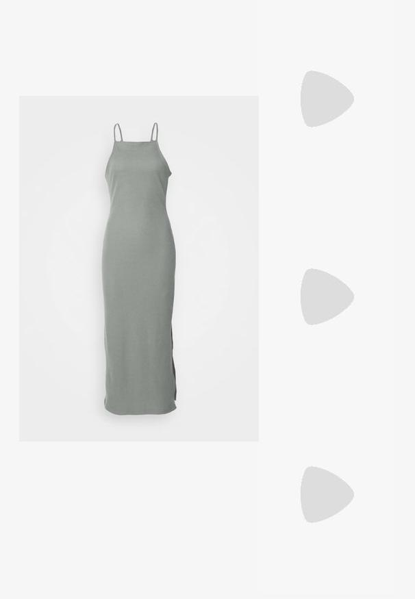 Siva rebrasta maksi haljina s tankim naramenicama, koja ima ravni siluetu i bočne proreze za lakše kretanje. Mekani materijal.; Zelene platform tenisice od suede materijala s bijelim detaljima, vezicama i gumenim potplatima, uparene s plavim trapericama i bijelim rebrastim čarapama.; Naočale s okvirom od zlatnog metala s pravokornim lećama narančaste nijanse. Odlikuju se tankim krakovima i suptilnim teksturiranim detaljima u blizini šarki.; Srebrne kružne naušnice s glatkom, poliranom površinom. Okrugli oblik i sigurno kopčanje na klik. Lagani dizajn pogodan za svakodnevno nošenje.