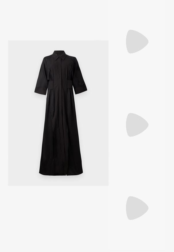 Rochie cămașă neagră, cu mâneci lungi, confecționată dintr-un material neted. Are guler, închidere cu nasturi și buzunare laterale, cu o croială lejeră și dreaptă.; Adidași din piele albă cu o talpă groasă albă, accent de călcâi din suede negru și logo embosat pe lateral. Design cu șireturi și șase orificii.; Ochelari de soare supradimensionați, negri, cu o formă geometrică, având lentile întunecate și un detaliu gri contrastant pe ramă. Logo pe braț.; Cercei rotunzi din argint cu un finisaj neted și strălucitor. Design ușor, având o formă rotundă și închidere cu tijă.