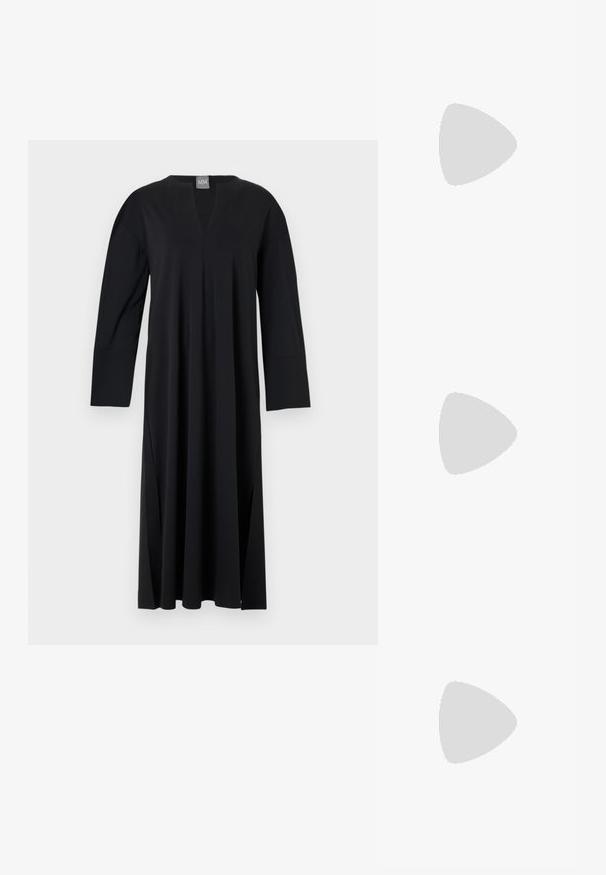 Black long-sleeve dress with a V-neck, made of smooth fabric. Features side slits, relaxed fit, and a seamless shoulder design.; Black patent leather flat shoe with a squared toe, ankle strap featuring silver hardware, and flat sole. Smooth texture with minimalist design.; Black leather handbag with fringe details, gold chain shoulder strap, and a cut-out handle. Features logo placement on the front.; Gold-tone earrings with multiple cascading chains, featuring clear oval rhinestone accents and decorative stud tops.