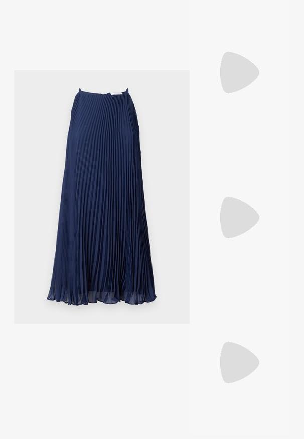 Navy pleated skirt made of lightweight fabric, featuring vertical folds, a flowing silhouette, and a discreet zipper closure at the back.; White leather sneakers, low-top design, featuring a smooth texture, round toe, laced front, and a small embroidered logo on the side.; Black leather half-moon bag with a gold hardware accent, featuring a zip closure. Worn crossbody over a gray sweater.; Gold-tone knot stud earrings with a twisted design. Each earring features a circular clear backing for secure wear.