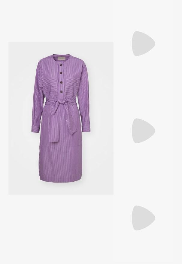 Purple striped dress featuring a round neckline, long sleeves, front button placket, two chest pockets, and a tied waist belt.; Black flat slide sandal made of synthetic material, featuring a wide strap with a metallic logo accent and a smooth, glossy finish.; Black sunglasses with oversized, rounded frames. Lenses gradient from dark to light. Features a sleek, glossy finish and subtle logo accents on temples.; Black quilted leather handbag with a gathered top, gold chain strap, and a rectangular shape, held against a plain background.