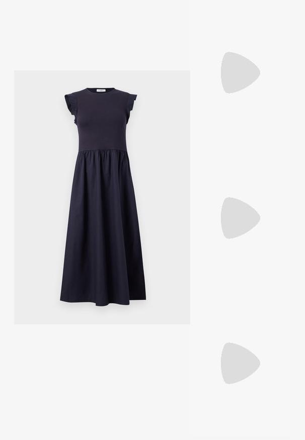Navy dress featuring a fitted bodice, ruffled cap sleeves, and a flared skirt with a gathered waist. Made from a smooth, lightweight fabric.; Black patent leather slingback heels with a pointed toe, a rounded cutout design, and a block heel. Features a gold-tone buckle accent.; Black oversized sunglasses with gradient lenses, thick frames, and gold-tone chain detailing on the temple arms.; Black handbag with structured shape, smooth texture, and a metallic clasp. Paired with wide black pants and open-toe sandals on wooden floor.
