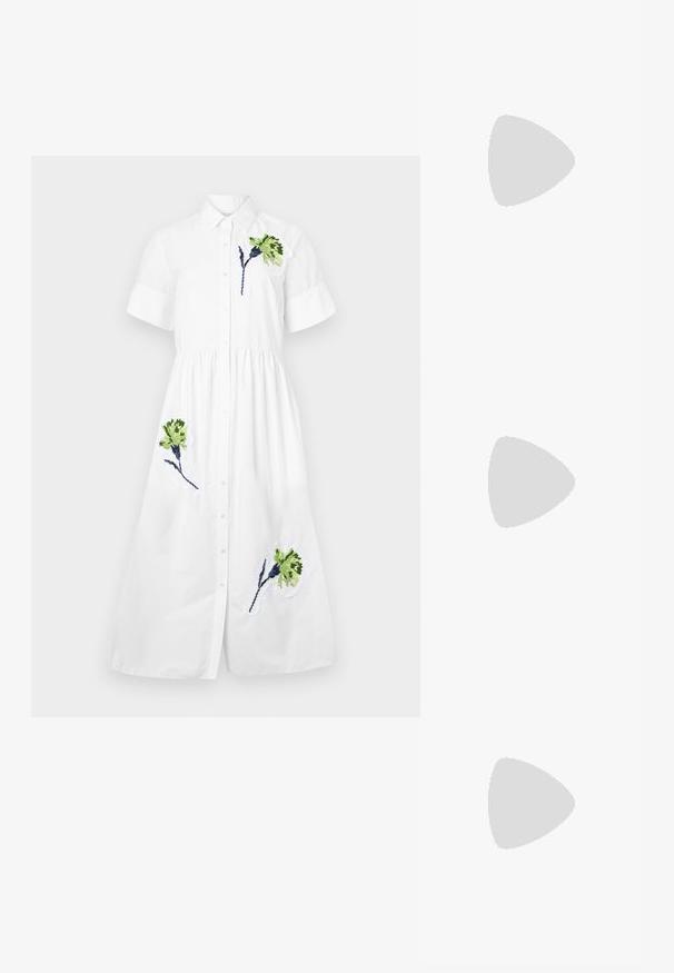 Valge särgimekko lühikeste varrukatega, nööpidega ees, kokku volditud talje ning rohelise ja sinise lilleline tikand vasakul rinnal ja alläärs.; Must must sandaalid, millel on õhukesed rihmad, madal plokknina ja ruudukujuline varvas. Omab kinnitust nahkel ja sile pind.; Roosa varjundiga prillid geomeetrilise raamiga, koos pehme lavendlivärvi tipuga, millel on ümar kaelus ja lühikesed varrukad.; Kuldse tooniga käevõru ovaalse amuletiga ja mustriga detailiga, valge riba, kantud tumeda nahaga käel. Taustal erkkollane särk.