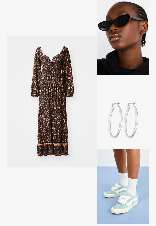 Čierna maxi šaty s kvetinovým vzorom a dlhými naberanými rukávmi, s okrúhlym výstrihom, riaseným tělom a vzorovaným okrajom. Vyznačuje sa farebnými kvetinovými motívmi.; Svetlomodré semišové tenisky s bielymi akcentmi a šnúrkami. Zaoblená špička so štruktúrovaným povrchom. Nosené s bielymi členkovými ponožkami na modrom povrchu.; Čierne slnečné okuliare v štýle mačacích očí s matným povrchom, s elegantným dizajnom a jemne zakrivenými hranami, umiestnené na pozadí modela v tmavom oblečení.; Strieborné kruhové náušnice s hladkým, lesklým povrchom. Kolový tvar a bezpečné klikanie na uzatváranie. Ľahký dizajn vhodný na každodenné nosenie.