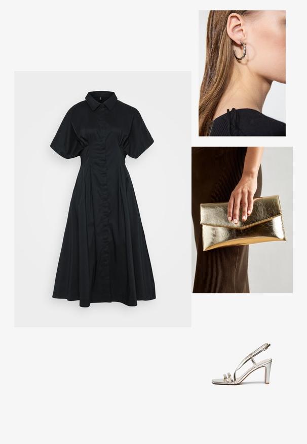 Juoda suknelė marškiniais su trumpomis, plačiomis rankovėmis, mygtukų užsegimu priekyje ir pilna, klostyta sijona. Pagaminta iš lygaus, lengvo audinio.; Metallic sidabriniai aukštakulniai sandalai su atvira nosimi, turintys tris plonas dirželius per pėdą ir kulkšnies dirželį su sagtimi.; Auksinės metalinės rankinės su lygiu paviršiumi, kuri turi trikampio formos užsegimą. Ranką laikančioji turi tvarkingai prižiūrėtus nagus.; Sidabrinė lankinė auskarai su poliruotu paviršiumi, turintys mažus auksinius akcentus ir apvalią formą, dėvimi ant ausies kaušelio.