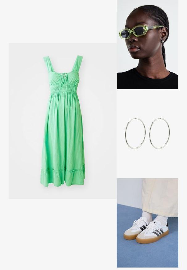 Abito maxi verde senza maniche con corpino arricciato, dettaglio frontale con lacci e orlo a balze. Realizzato in tessuto leggero e testurizzato.; Sneakers bianche con strisce nere e accenti in suede beige. Presentano una suola in gomma texturizzata e lacci bianchi piatti, indossate con calzini di colore chiaro.; Occhiali da sole tinti di verde con una montatura slim e rettangolare e lenti scure; aste grigie con texture e branding. Pelle liscia e una maglietta nera.; Orecchini a cerchio in argento con una finitura liscia e lucida. Forma circolare, larghezza costante, progettati per un facile fissaggio. Semplici ed eleganti.