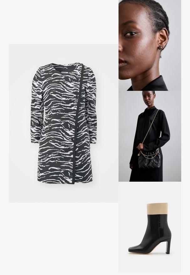 Abito con stampa zebra in bianco e nero, maniche lunghe, scollatura rotonda e bottoni laterali. Presenta un tessuto testurizzato e un design asimmetrico.; Stivaletto in pelle nera con dettaglio crema nella parte superiore, punta affilata e tacco alto con accentuazione argentata. Texture liscia senza motivi visibili.; Borsa a tracolla in pelle nera trapuntata con apertura arricciata, tracolla in catena dorata e forma rettangolare, appoggiata su uno sfondo semplice.; L'orecchino a bottone floreale in oro presenta un centro nero texturizzato e dettagli delicati. La pelle chiara del modello e i capelli intrecciati sono visibili di profilo.