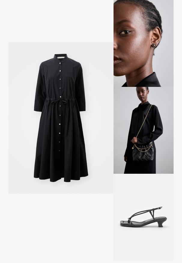 Czarna sukienka z długim rękawem wykonana z bawełny, z zapinanym przodem, talią ściągniętą sznurkiem oraz rozkloszowanym dołem.; Czarne skórzane sandały z cienkimi paskami, niskim blokowym obcasem i kwadratowym noskiem. Posiadają zapięcie na klamrę i gładką teksturę.; Czarna pikowana skórzana torebka z marszczonym topem, złotym łańcuchem oraz prostokątnym kształtem, trzymana na jednolitym tle.; Złote kolczyki w kształcie kwiatu posiadają teksturowane czarne centrum i delikatne detale. Skóra modelki o przejrzystej cerze oraz splecione włosy są widoczne w profilu.