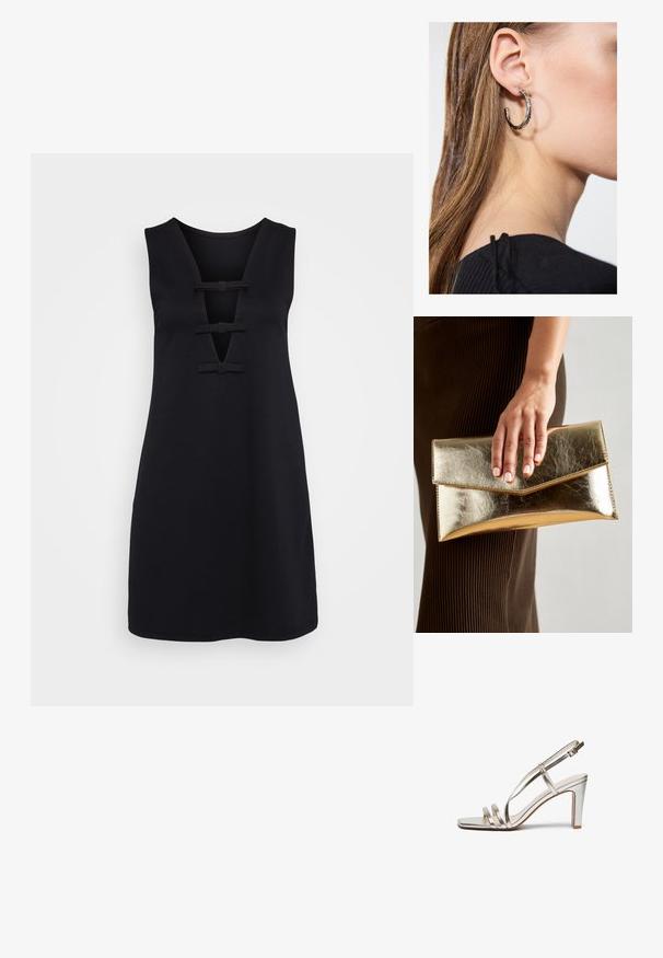 Melnas kleitas no gludas auduma, ar V veida izgriezumu, kurā ir trīs dekoratīvas lentītes un bez piedurknēm. Ceļgala garuma griezums.; Metāliski sudraba augstpapēžu sandaļi ar atvērtu purngalu, kas aprīkoti ar trim plāniem siksniņām pāri pēdai un potītes siksniņu ar sprādzi.; Zelta metalizēta sajūga soma ar gludu tekstūru, kuru rotā trīsstūrveida vāks. Rokai, kas to tur, ir kārtīgi apgriezti nagi.; Sudraba auskars ar pulētu apdari, ar maziem zelta akcentiem un apaļu formu, uz ausu ļipiņas.