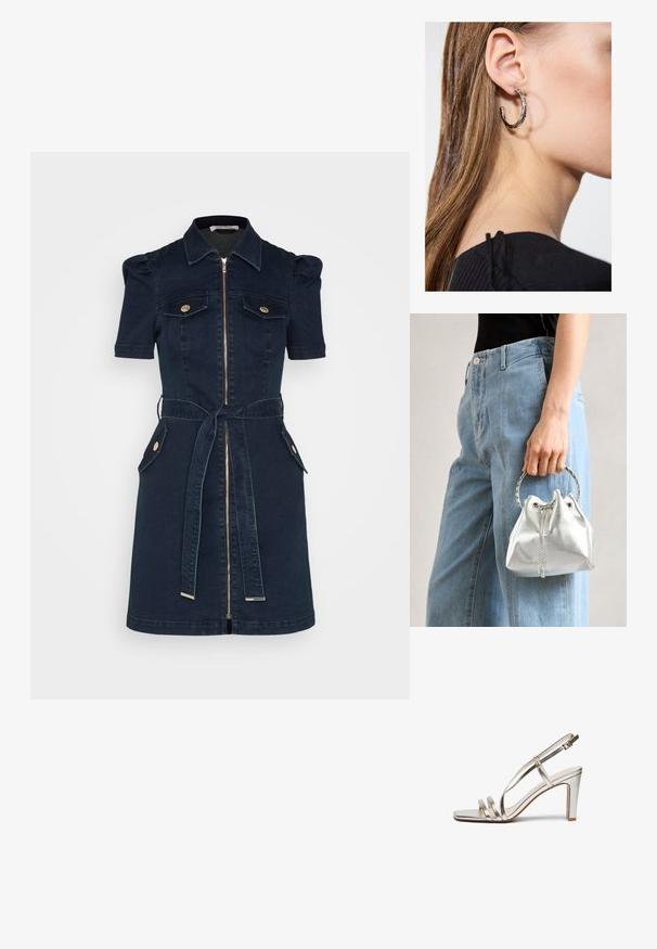 Rochie din denim navy cu mâneci scurte tip puff, fermoar pe față, două buzunare la piept, curea de talie și accente cu nasturi de ton aurii.; Sandalie cu toc înalt, metalice, argintii, cu vârful deschis, având trei bretele subțiri peste picior și o bretea pentru gleznă cu cataramă.; Geantă tip bucket metalică argintie, cu un finisaj texturat, decorată cu o mânere rotundă argintie și închidere cu șnur, ținută lângă blugi albaștri deschiși.; Cercel din argint cu un finisaj polișat, având detalii mici din aur și o formă rotundă, purtat pe lobul urechii.