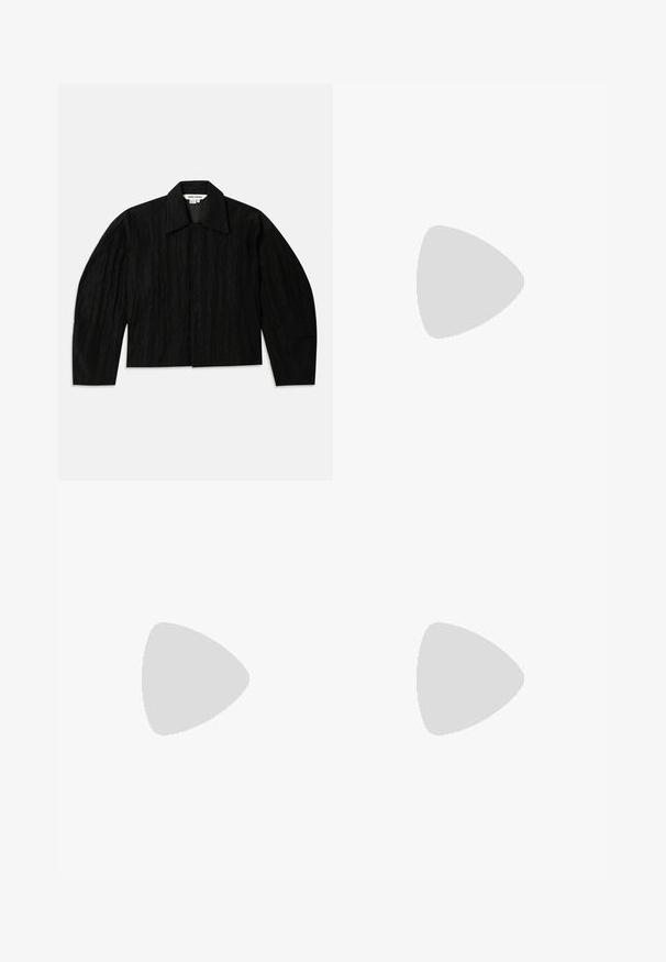 Black cropped jacket with a textured surface, wide collar, and long, slightly tapered sleeves. Features a hidden front closure.; Cream long-sleeve t-shirt featuring a colorful graphic print titled "The Lost Knowledge," depicting a pyramid and digital face elements.; Wide-leg trousers in black fabric, featuring front pleats, a flat front, and belt loops. Smooth texture with no visible patterns or accents.; Navy blue suede low-top sneaker with white sole, navy laces, and "Filling Pieces" logo in gold on the side.