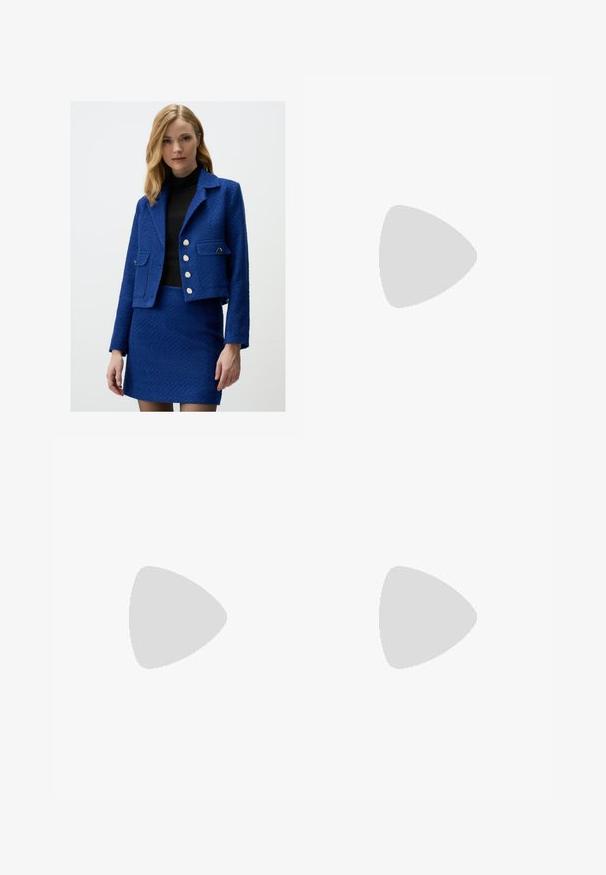 Blue textured jacket with a cropped design, silver buttons, and two front pockets, paired with a matching skirt. Worn over a black top.; White short-sleeve t-shirt made from smooth fabric, featuring a round neckline and subtle stitching details at the hem.; White wide-leg pants made of soft fabric. Features an elastic waistband with a drawstring and a smooth texture. No visible patterns or hardware.; Beige suede slide-on clogs with a cork footbed, rounded toe, and a simple strap featuring a gold-tone buckle. Rubber sole for grip.; Black plastic eyeglasses with an oval shape, featuring clear lenses and one purple accent on the left lens. Sleek, minimal design.
