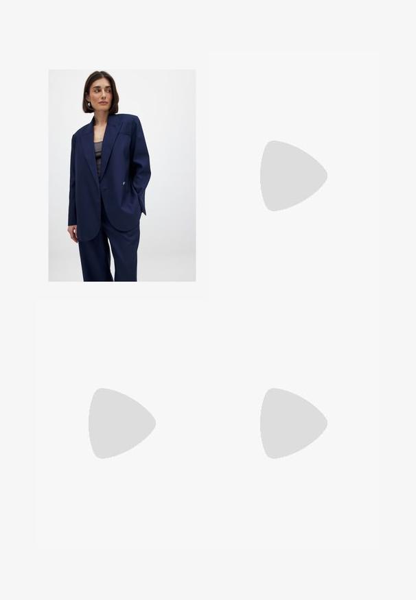 Navy blue oversized blazer made from smooth fabric, features a single button closure, notch lapels, and a subtle chest pocket detail.; White ribbed tank top with a round neckline and sleeveless design, featuring a straight hem and a smooth, stretchy texture.; Light blue denim jeans with a relaxed fit, straight leg, five-pocket design, and minimal fading throughout the fabric.; Black flip-flop featuring a textured rubber sole, two slender straps, and a subtle, embossed logo detail on the strap.