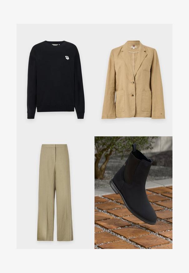 Beige vászon zakó, amelyet hegyes hajtókával, két elülső zsebbel és két gombbal zárható. Jellemzője egy szívzseb és látható varrási részletek.; Fekete pamut pulóver. Hosszú ujjakkal, kerek nyakkivágással rendelkezik, és a bal mellrészen egy kis fehér virágmotívumos hímzés található.; Világos zöld, bő szárú nadrág, amely vászonból készült. Magas derékkal és tiszta elülső kialakítással rendelkezik, egyetlen redővel.; Fekete bokacsizma rugalmas oldalpanellel, amely lebeg egy fa négyzetcsempe felett, kövekkel egy szabadtéri környezetben.