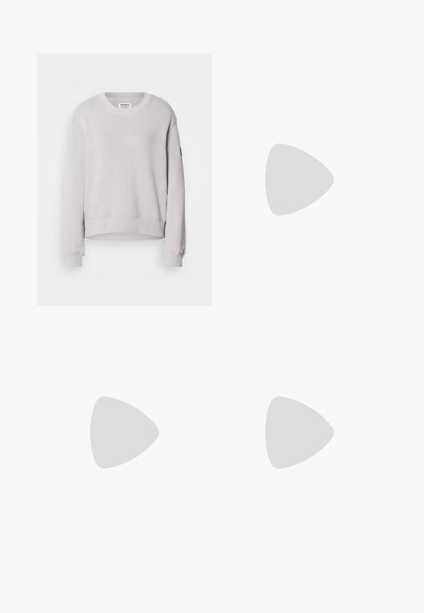 Light gray sweatshirt with a round neck, long sleeves, ribbed cuffs, and a slightly cropped hem. Features subtle front stitching.; Light blue denim jeans with a relaxed fit, straight legs, and subtle fading. Features a front button closure and five pockets for utility.; Brown and cream sneakers with a combination of suede and satin materials, featuring three diagonal stripes and a textured gum sole.; Silver hoop earring with a polished finish, featuring small gold accent details and a round shape, worn on the lobe.