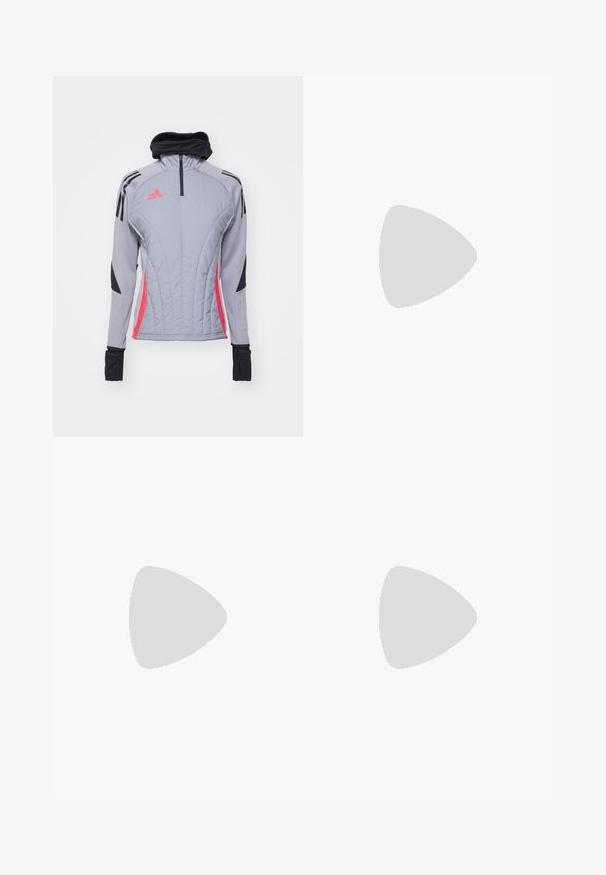 Grey long-sleeve jacket with pink and black accents, featuring a high collar, quarter zip, and padded texture with vertical stitching.; White cotton t-shirt with a black ribbed collar, short sleeves, black stripe accents, and a yellow smiley face embroidered on the chest.; Cream-colored wide-leg pants with a zigzag pattern, featuring a black logo waistband and side black stripes. Lightweight, textured fabric.; Light pink athletic shoes with diagonal stitching, white soles, and three lateral stripes. Worn with ribbed white socks on green surface.