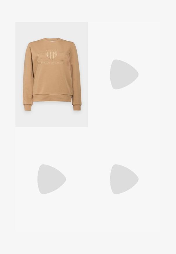 GANT TONAL SHIELD C NECK - Športni pulover - caramel beige; Gubasta bela krila z črnim elastičnim pasom, ki nosi logotip "LACOSTE". Srednje dolga zasnova z mehkobo tkanine.; Bele usnjene športne copate z debelim belim podplatom, črnimi semišnimi detajli na peti in utisnjenim logotipom na strani. Zavezovanje s šestimi luknjicami.; Črne prevelike sončne očala geometrijske oblike, z temnimi lečami in kontrastno sivo podrobnostjo na okvirju. Logo na ročaju.