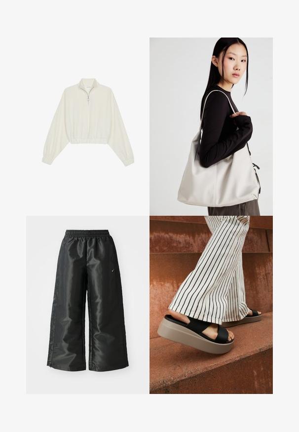 Pullover curto em tecido creme, apresentando um colarinho alto, fecho de meio zíper, bainha e punhos elásticos, com uma textura suave e design minimalista.; Calças atléticas pretas com um tecido brilhante e suave, apresentando uma cintura elástica, pernas largas e um pequeno logotipo do lado esquerdo.; Chinelos pretos com tiras cruzadas largas, apresentando uma sola grossa em bege, combinados com calças flare de riscas creme sobre uma superfície avermelhada.; Uma bolsa bege feita de material macio, com um design descontraído, detalhes de costura e duas alças para o ombro. Adequada para uso diário.