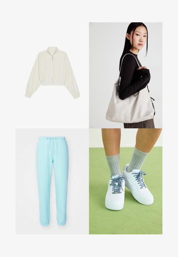 Krém színű, rövidített pulóver, magas gallérral, félig cipzáros záródással, elasztikus derék- és ujjakrésszel, sima textúrával és minimalista dizájnnal.; Világoskék melegítő nadrág, rugalmas derékkal, állítható zsinórral és árnyékos lábszárral. Puha, sima anyagból készült, látható logók nélkül.; Fehér bőr sportcipő kék akcentusokkal, perforált orrdesignnal és texturált kék-fehér cipőfűzőkkel, szürke bordás zoknikkal viselve.; Puha anyagból készült bézs kézitáska, laza dizájnnal, varrott részletekkel és két vállpánttal. Mindennapi használatra alkalmas.