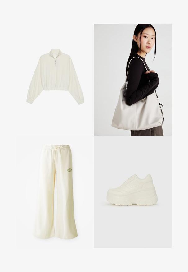 Pullover curto em tecido creme, apresentando um colarinho alto, fecho de meio zíper, bainha e punhos elásticos, com uma textura suave e design minimalista.; Calças de fato largas em creme com cintura elástica e cordão ajustável. Texto bordado em verde "Athletic" na frente. Tecido suave.; Tênis brancos de plataforma com um cabedal suave semelhante a couro, formato arredondado, colarinho acolchoado e sola de borracha texturizada com ranhuras bem definidas.; Uma bolsa bege feita de material macio, com um design descontraído, detalhes de costura e duas alças para o ombro. Adequada para uso diário.
