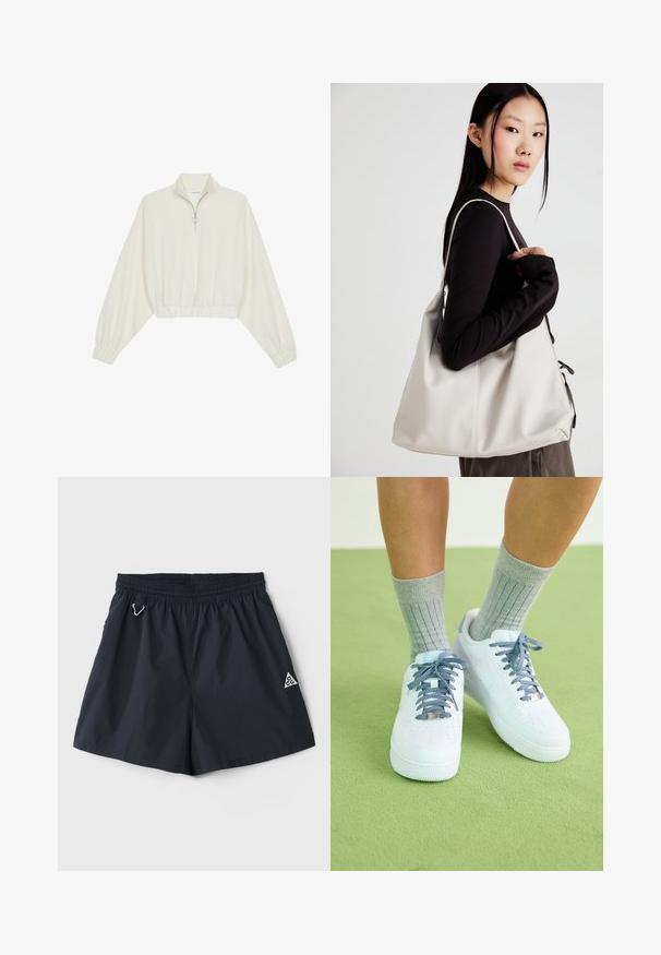Pullover curto em tecido creme, apresentando um colarinho alto, fecho de meio zíper, bainha e punhos elásticos, com uma textura suave e design minimalista.; Calções leves de cor azul-marinho com um cós elástico, bolsos laterais e um pequeno logotipo triangular; textura suave, design minimalista.; Sapatilhas de couro brancas com detalhes azuis, design de biqueira perfurada e atacadores texturizados azul e branco, usadas com meias cinzas caneladas.; Uma bolsa bege feita de material macio, com um design descontraído, detalhes de costura e duas alças para o ombro. Adequada para uso diário.