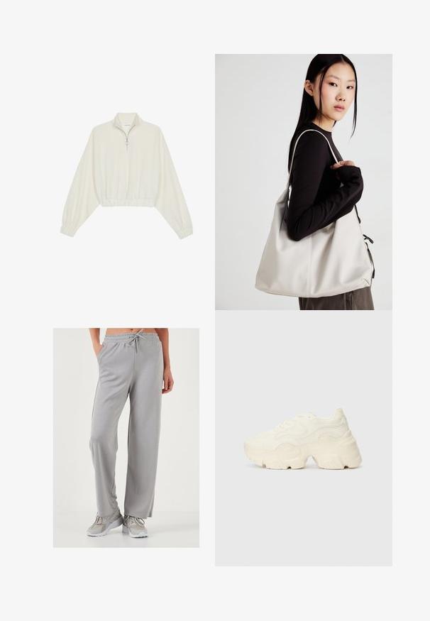 Kort striktrøje i cremefarvet stof med høj krave, halvlynlås, elastisk kant og manchetter, glat tekstur og minimalistisk design.; Lys grå, brede sweatpants i blødt og glat stof; har en elastisk talje med snor og sidelommer.; Chunky hvide sneakers lavet af tekstureret mesh og syntetiske materialer, med en tyk sål og intrikate mønsterdetaljer langs siderne.; Beige håndtaske lavet af blødt materiale med et slouchy design, stikninger og to skulderremme. Velegnet til daglig brug.