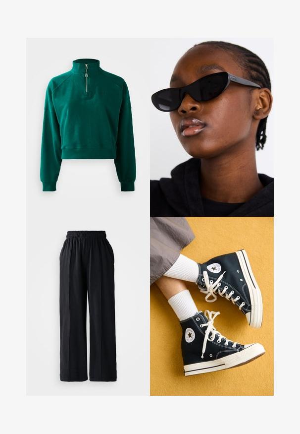 Sötétzöld, crop fazonú pulóver, félig cipzáros gallérral, bordázott mandzsettákkal és puha tapintással. Hímzett logóval a mellkasán.; Fekete, bő szárú nadrág, rugalmas derékkal, puha szövetből készült, sima textúrával és letisztult dizájnvonalakkal.; Fekete magas szárú vászon sportcipő, fehér fűzőkkel és gumitalppal, a külső oldalán egy kerek Converse All Star logóval.; Fekete macska szemüveg napszemüveg, matt felülettel, amely karcsú formájával és finoman ívelt széleivel tűnik ki, egy modell sötét ruhái háttérben.