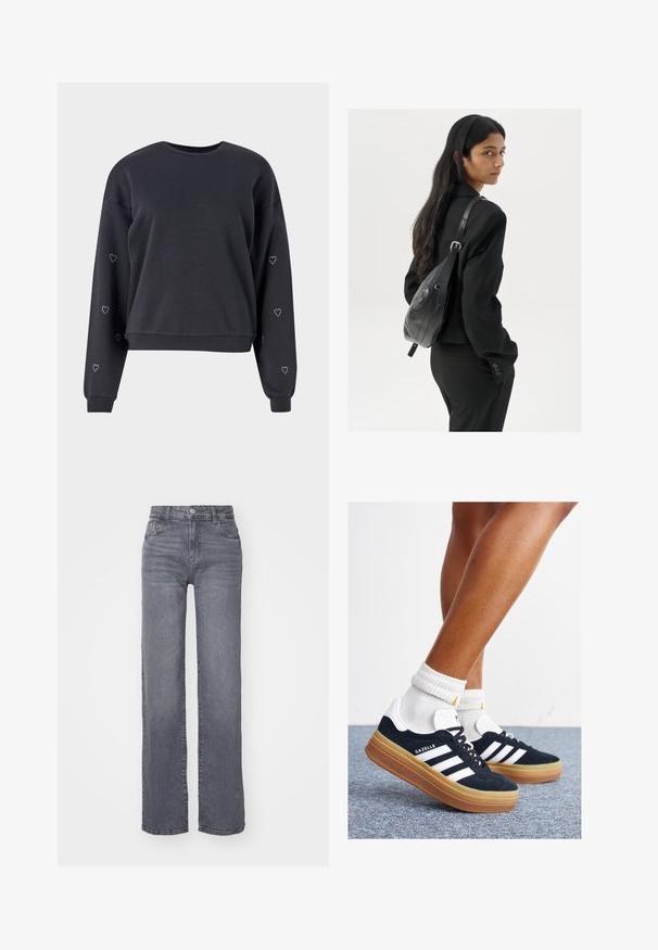 Felpa nera realizzata in morbido tessuto, caratterizzata da maniche lunghe con piccoli accenti a forma di cuore in strass lungo le braccia e un colletto rotondo.; Jeans grigi ampi realizzati in denim con una finitura liscia, dotati di chiusura con bottone e zip, e cinque tasche.; Sneakers in pelle scamosciata nera con strisce e dettagli bianchi, punta arrotondata, suola in gomma color gomme, abbinate a calzini bianchi a coste alla caviglia.; Donna con lunghi capelli scuri, vestita con un completo nero, che porta una borsa a tracolla in pelle nera, mentre guarda oltre la spalla su uno sfondo bianco.