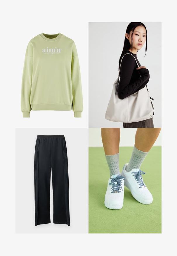 Gaiši zaļš džemperis ar apaļu kaklu, ribotām piedurknēm un apakšmalu. Uz priekšas ir balts logo teksts. Mīksta, teksturēta auduma.; Melnas sporta bikses no mīksta auduma ar platām kāju daļām, elastīgu vidukļa jostu un vertikālām krokām sānos.; Baltas ādas kedas ar ziliem akcentiem, perforēta purngala dizains un teksturētas zili un baltas šņores, valkātas ar pelēkiem ribotiem zeķēm.; Bežs rokassoma, izgatavota no mīksta materiāla, ar brīvu dizainu, izšūtu apdari un divām plecu siksnām. Piemērota ikdienas lietošanai.