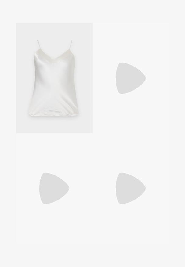 Paul & Joe VBOTANIC - Blouse - ecru; Flared blue denim jeans featuring a high waist, five-pocket design, and subtle fading across the fabric for texture and depth.; Black leather ballet flat with a rounded toe, smooth texture, minimal stitching detail, and a flexible sole design.; Black leather crossbody bag with a curved shape, gold hardware accents, adjustable strap, and logo in gold on the front.