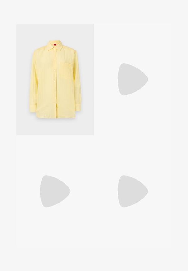 Yellow long-sleeve shirt with a button-down collar, single chest pocket, and a textured fabric. Features white buttons and a relaxed fit.; Samsøe Samsøe HARPER - Wide Leg - frozen snow; Gray pinstriped wide-leg trousers with a smooth texture, paired with black leather flats featuring a rounded toe.; Blush pink, smooth leather bag with gathered top, drawstring closure, and a thin strap. Features a subtle Calvin Klein logo on the front.