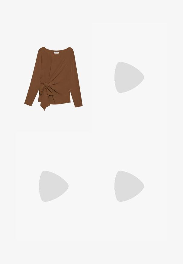 Brown long-sleeve top featuring a wide neckline and a knot detail on one side, made of soft, textured fabric.; Pleated wide-leg trousers in light beige, featuring an elastic waistband. Made from lightweight fabric with vertical texture throughout.; Brown suede ankle boot with a rounded toe, block heel, and a decorative strap featuring a circular buckle detail.; Black handbag with structured shape, smooth texture, and a metallic clasp. Paired with wide black pants and open-toe sandals on wooden floor.
