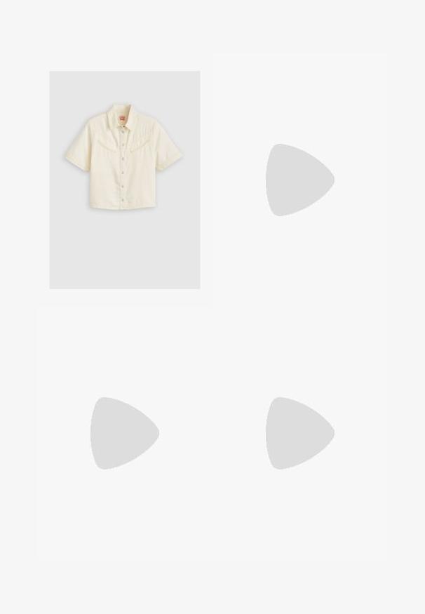 Chemise à manches courtes en coton crème. Elle possède deux poches poitrine avec des rabats inclinés, un col classique et des boutons-pression en métal argenté.; Pantalons bruns ajustés en tissu lisse et extensible. Jambes droites et taille plate sans matériel visible ni poches.; Des chaussures de course légères en rose pastel et lavande avec une tige en mesh respirant, des accents texturés et une semelle rembourrée pour le soutien.; Sac à épaule en daim beige avec une grande ouverture et de longs accessoires en frange de chaque côté, présentant une texture lisse et une seule anse.