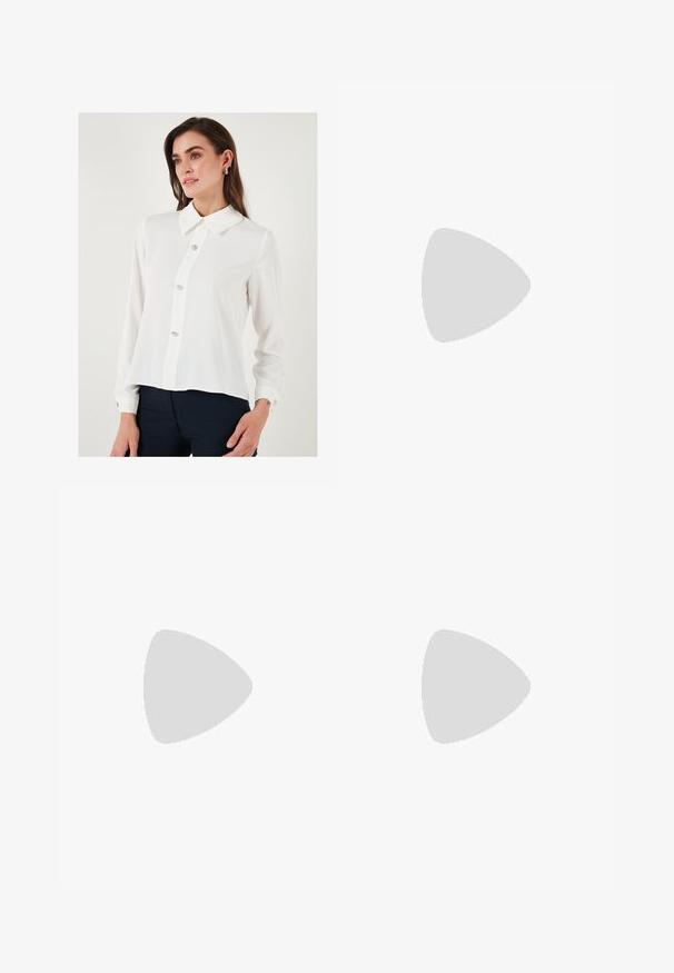 White long-sleeve blouse with a pointed collar, featuring five decorative buttons down the front and buttoned cuffs. Smooth, lightweight fabric.; Brown wide-leg jeans made of denim, featuring a front button closure, five pockets, and visible stitching details.; Burgundy patent leather slingback shoes with a pointed toe, featuring two adjustable buckled straps and silver hardware accents.; Gold mesh strap watch with a black round dial, minimalist indices, and a silver crown; features a logo at 12 o'clock position.