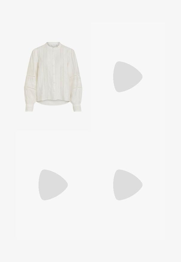White blouse featuring a mandarin collar, button closure, and pleated details. Billowy long sleeves with intricate lace accents. Lightweight fabric.; Blue denim jeans with a straight leg design, featuring slight fading, a classic five-pocket layout, and visible stitching details.; Black platform heels with a pointed toe and adjustable ankle strap. Constructed from smooth leather, featuring a chunky block heel.; Black leather handbag with a curved shape, detachable strap, and gold hardware. The bag features a flap with a buckle detail.