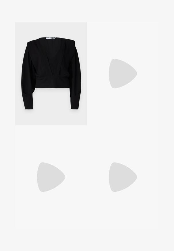 Black cropped blouse with a deep V-neck, long sleeves, and structured shoulders. Made from soft, matte fabric with minimal detailing.; Black tailored trousers with a straight leg, two front pockets, a button closure, and pleat detailing on the front. Smooth fabric texture.; Black leather sandal with adjustable buckle, flat tan sole, and two wide straps crossing over the foot, minimalistic design.; Black leather handbag with a silver chain strap, featuring decorative wing accents and white stitching along the bottom seam.