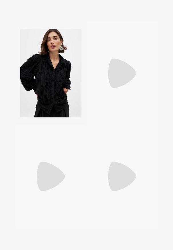 Black button-up shirt with textured, frayed stripes; features a collar and loose, long sleeves; made of soft, lightweight fabric.; Light blue wide-leg jeans made of denim, featuring a high waist, five-pocket design, and subtle fading along the legs.; Brown suede slide sandal with a rounded toe, adjustable buckle strap, and textured insole. Features a black rubber sole with ridges.; Brown suede hobo bag with a rounded shape, studded accents along one side, and a single shoulder strap for carrying.; A stack of two rings; the top is amber with swirls, and the bottom is light beige; both are smooth and glossy resin.