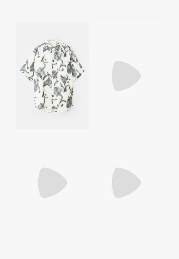Short-sleeve shirt in a cream fabric featuring a gray floral pattern, with a button front and a classic collar.; White cotton T-shirt with oversized design, round neck, short sleeves, and printed text accents in light beige. Smooth texture.; Navy blue trousers made of cotton, featuring a relaxed fit, front pleats, and a flat waistband with belt loops.; Brown suede sneaker with white laces, rounded toe, and a textured rubber sole. Features a stitched accent along the sole edge.